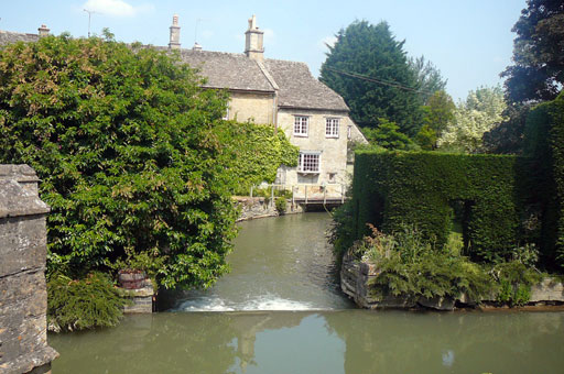 An English village river scene shown in comparison and wondering if it was a deam or real